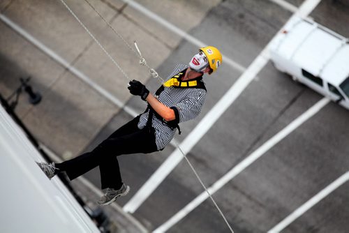 Stuart klassen rappels  down the side of the wall of the RBC building, 200 feet during the annual Easter Seals Drop Zone event.  Money raised in the the fundraising event  goes to Manitoban's living with disabilities.   Standup photo Aug 21, 2014 Ruth Bonneville / Winnipeg Free Press