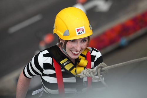 One of the participants in the Easter Seals Drop Zone dressed as a mime is all smiles as she rappels down the  RBC building Thursday.  Money raised in the the fundraising event  goes to Manitoban's living with disabilities.   Standup photo Aug 21, 2014 Ruth Bonneville / Winnipeg Free Press