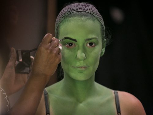 Alyssa Fox has her green makeup applied for the part of Elphaba in the musical Wicked. The makeup process that turns Fox into the Wicked Witch of the West takes about 30 minutes. Makeup artist Joyce McGilberry uses a green water-based pancake makeup, and finishes with powder, so the green won't transfer to clothes or other performers. Wicked is playing at the Centennial Concert Hall Aug 20-30 140821 - Thursday, August 21, 2014 - (Melissa Tait / Winnipeg Free Press)