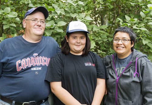 Belle Walters, 10, with her father Jim and mother Corky. She said this summer enjoyed archery the most about her second time attending camp. Sarah Taylor / Winnipeg Free Press August 21, 2014