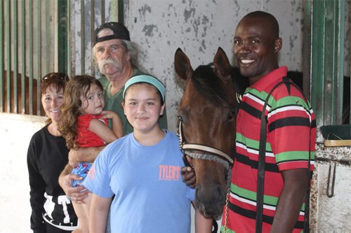 Charlie Smith and Family L to R  Owner Terry Propps, Lola, Trainer Charlie Smith, Maddy, groom Vaughan Taylor with Graduation Stakes winner Spider's Alibi  George Williams / Winnipeg Free Press August 2014