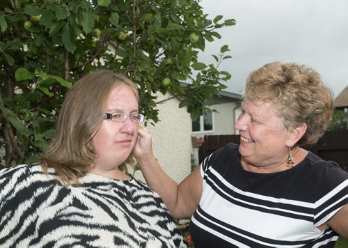 Gloria Woloshyn (right) and her daughter Jaylene currently live together in their Winnipeg home. Jaylene, who has Prader-Willi Syndrome, will have to live in community living as her mother gets older. Gloria is concerned with the systemic problems within community living. Sarah Taylor / Winnipeg Free Press August 21, 2014 Oliver's story