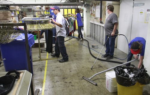 Cleaners were washing and disinfecting the floor of the Siloam Mission Friday after water from the overnight rain storm got into the basement. Adam Wazny story Wayne Glowacki/Winnipeg Free Press August 22 2014