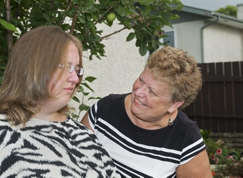 Gloria Woloshyn (right) and her daughter Jaylene currently live together in their Winnipeg home. Jaylene, who has Prader-Willi Syndrome, will have to live in community living as her mother gets older. Gloria is concerned with the systemic problems within community living. Sarah Taylor / Winnipeg Free Press August 21, 2014 Oliver's story