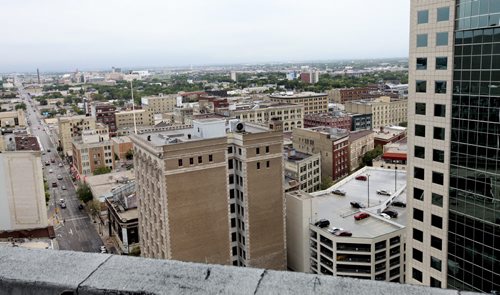 View of Exchange District from top of RBC building looking north west.  Notre Dame Ave. is in left hand side of picture.  Century old buildings in photo include Electric Railway Chambers, Hammond Building and Silpit Building to name a few.  Aug 21/2014  Ruth Bonneville / Winnipeg Free Press