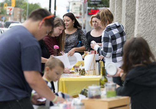 People come out to Hidden Treasures and Crockadoodle during Osborne South Biz's fourth annual Sidewalk Festival. Sarah Taylor / Winnipeg Free Press August 23, 2014