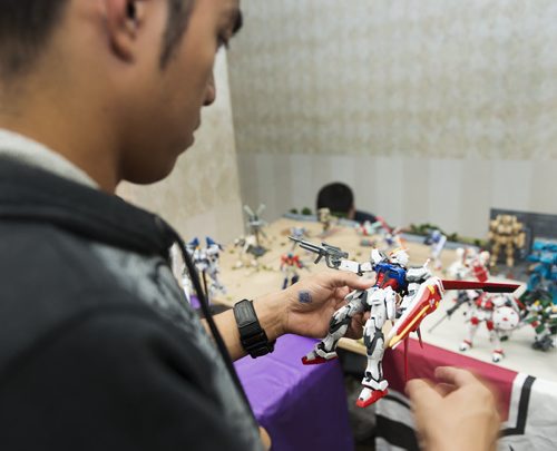 Czarnel Ramos holds a gunpla figure at the Transformers Convention at the Clarion Hotel on Saturday. Sarah Taylor / Winnipeg Free Press August 23, 2014