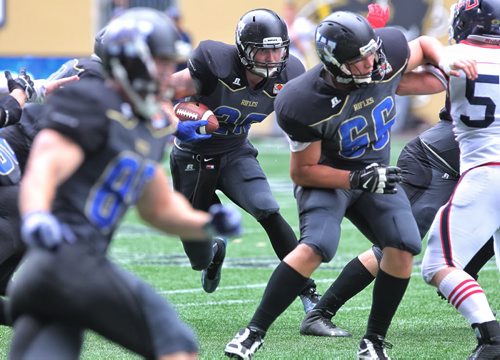 Winnipeg Rifles' Colton Smith (28) moves the ball upfield in the first quarter during game action against the Calgary Colts at Investors Group Field Sunday afternoon. The Rifles were winning 28-7 at the half.  140824 August 24, 2014 Mike Deal / Winnipeg Free Press
