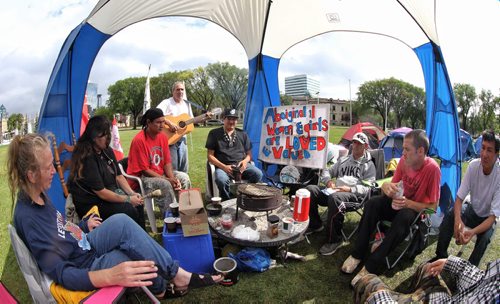 People at a protest camp for stolen women and children gather for coffee and talk about staying at the campsite in Memorial Park until PM Stephen Harper changes his mind and calls a national inquiry into missing and murdered women.  140824 August 24, 2014 Mike Deal / Winnipeg Free Press