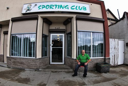 Tony Pereira owner of the Sporting Club of Portugal located on Notre Dame Ave has set out a card and is raising money for flowers for Helder Serpa, 57, who was killed while walking home early Saturday morning. Mr. Serpa was at his club watching the Bomber game before heading to a nearby Legion where he was last seen drinking with friends.  140824 August 24, 2014 Mike Deal / Winnipeg Free Press