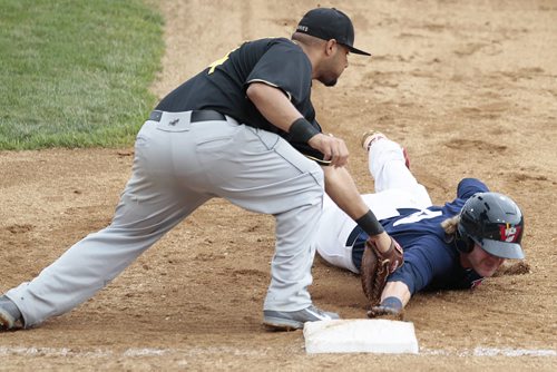 August 24, 2014 - 140824  -  Winnipeg Goldeyes Brock Bond (9) is tagged out at first by Sioux Falls Canaries A.J. Kirby-Jones (44) while trying to steal second in Winnipeg Sunday, August 24, 2014. John Woods / Winnipeg Free Press