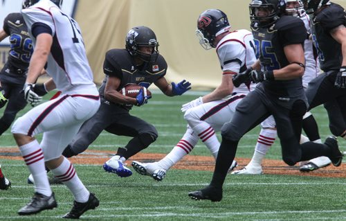 Winnipeg Rifles' Victor St. Pierre-Lavoile (22) runs the ball during a game against the Calgary Colts at Investors Group Field Sunday afternoon.  140824 - Sunday, August 24, 2014 -  (MIKE DEAL / WINNIPEG FREE PRESS)