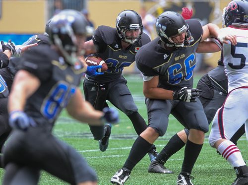 Winnipeg Rifles' Colton Smith (28) moves the ball upfield in the first quarter during a game against the Calgary Colts at Investors Group Field Sunday afternoon.  140824 - Sunday, August 24, 2014 -  (MIKE DEAL / WINNIPEG FREE PRESS)