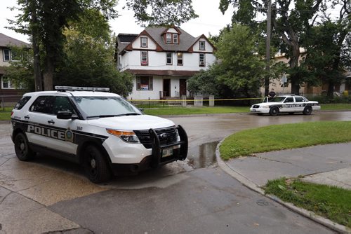 LOCAL- WPS are investigating an assualt  incident  , taping off a large  two and a half story duplex possibly a  rooming house  on Austin St. N.  At  Lorne Ave . Aug 25 2014 / KEN GIGLIOTTI / WINNIPEG FREE PRESS