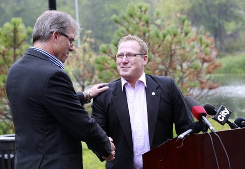 At the announcement Monday in Assiniboine Park, Coun. Scott Fielding at right endorses mayoral candidate Gord Steeves. Aldo Santin story Wayne Glowacki/Winnipeg Free Press August 25 2014