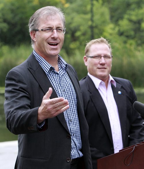 At the announcement Monday in Assiniboine Park, Coun. Scott Fielding at right endorses mayoral candidate Gord Steeves. Aldo Santin story Wayne Glowacki/Winnipeg Free Press August 25 2014