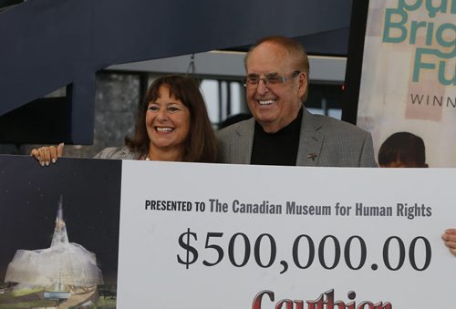 LOCAL STDUP - Jim Gauthier  of Jim Gauthier Auto Group donates $500,000 to the Canadian Museum for Human Rights ,this is his second donation , the first was for $1,000,000. Gail Asper  received  the donation .  Aug 25 2014 / KEN GIGLIOTTI / WINNIPEG FREE PRESS
