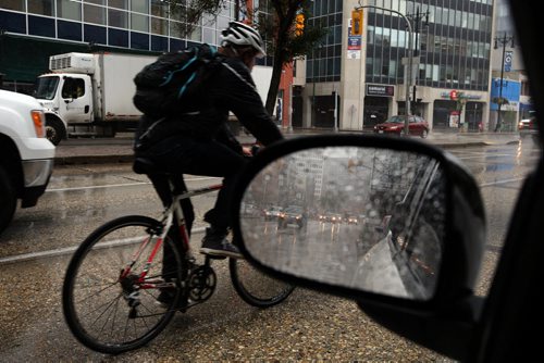 Stdup Weather -Liking to put this weather in a rear veiw mirror because the next three day calls for sunny and warm , today   steady rain is the order of the day 12 degrees  cloudy and windy  Aug 25 2014 / KEN GIGLIOTTI / WINNIPEG FREE PRESS