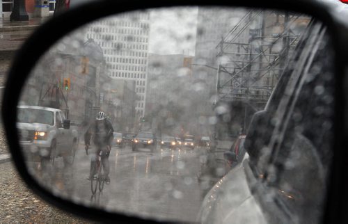 Stdup Weather - Want to put this weather in a review mirror , next three days sunny and warm , today  steady rain is the order of the day 12 degrees  cloudy and windy  Aug 25 2014 / KEN GIGLIOTTI / WINNIPEG FREE PRESS
