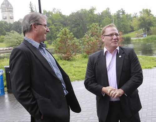 At the announcement Monday in Assiniboine Park, Coun. Scott Fielding at right endorsed mayoral candidate Gord Steeves. Aldo Santin story Wayne Glowacki/Winnipeg Free Press August 25 2014