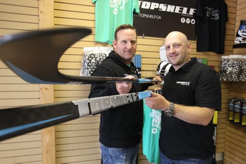 Rod Westendorf, right, is the owner of Top Shelf Hockey Co. with Top Self Hockey Co. Ryan Cruise.  Their company has designed a carbon one-piece hockey sticks that is based in Winnipeg. They're just launched their product to the market and they're currently working with a member of the Jets to see if they can custom make a stick for him.-See see Geoff Kirbyson  story- Aug 25, 2014   (JOE BRYKSA / WINNIPEG FREE PRESS)