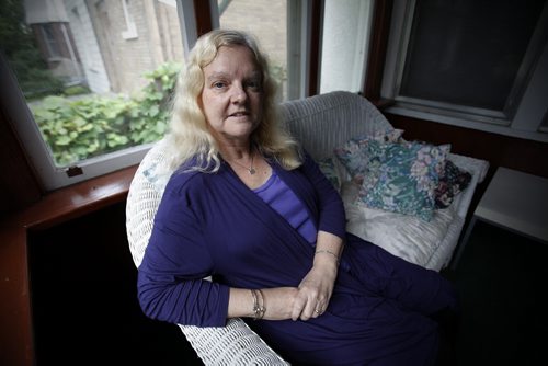 August 25, 2014 - 140825  -  Diane Driedger, who has fibromyalgia and won a human rights decision that allows people with episodic fatigue or pain to use Handi-Transit, is photographed in her Winnipeg home Monday, August 25, 2014. This opens the service up to more people. John Woods / Winnipeg Free Press