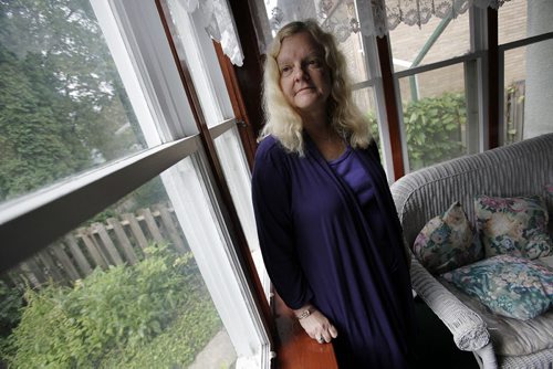 August 25, 2014 - 140825  -  Diane Driedger, who has fibromyalgia and won a human rights decision that allows people with episodic fatigue or pain to use Handi-Transit, is photographed in her Winnipeg home Monday, August 25, 2014. This opens the service up to more people. John Woods / Winnipeg Free Press