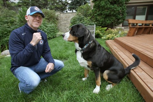 Mike Keane -Assistant Coordinator of Player Development for the Winnipeg Jets at his home with his Greater Swiss Mountain dog named Hank-See Tim Campbell story- Aug 26, 2014   (JOE BRYKSA / WINNIPEG FREE PRESS)