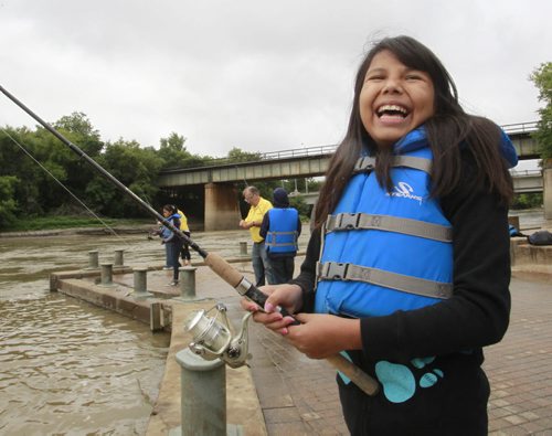 Though not a fish was caught, the fishing was great fun for Nikita Daniels,10, and the kids that took part in the Fish Winnipeg Youth at Risk Fishing Program held at The Forks Tuesday. The Fish Winnipeg Program introduces youth to a fun alternative outdoor activity and the participants received a complimentary rod and reel. Through out July and August more that 400 Winnipeg youth in the program enjoyed a day of fishing along Winnipeg's Red and Assiniboine Rivers.The program was offered through the City of Winnipeg's Community services in partnership with Fish Futures Inc and The Complete Angler. see release Wayne Glowacki/Winnipeg Free Press August 26 2014