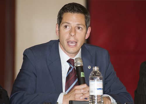 Brian Bowman speaks at Sisler High School Tuesday night as Manitoba Filipino Business Council confirms eight out of nine mayoral candidates. Sarah Taylor / Winnipeg Free Press August 26, 2014