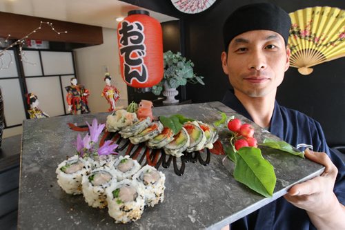Heejung Kim shows  tuna belly nigiri and  kamikazi roll at Watta Sushi - 837 Sherbrook - See Marion Warhaft review- Aug 27, 2014   (JOE BRYKSA / WINNIPEG FREE PRESS)