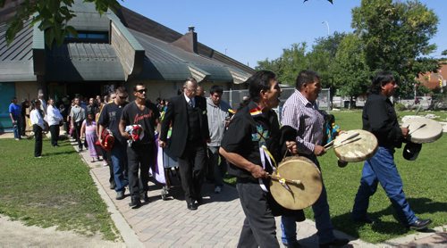Singers lead the procession to the hearse from Thunderbird House Wednesday after the funeral for Faron Hall. Gord Sinclair story. Wayne Glowacki/Winnipeg Free Press August 27 2014