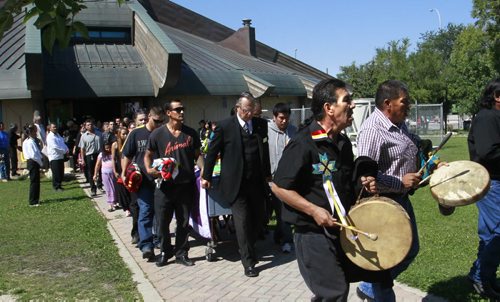 Singers lead the procession to the hearse from Thunderbird House Wednesday after the funeral for Faron Hall. Gord Sinclair story. Wayne Glowacki/Winnipeg Free Press August 27 2014