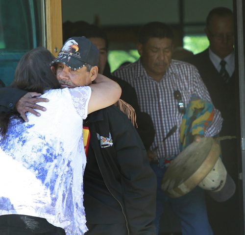 Friends and family comfort each other at the conclusion of the funeral for Faron Hall at Thunderbird House Wednesday. Gord Sinclair story. Wayne Glowacki/Winnipeg Free Press August 27 2014
