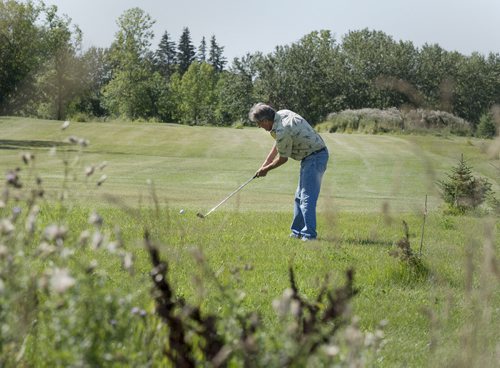 Jerry Cousins plays a round of golf on the course he and his wife Juanita started building in 2008 on their 65 acre property in Whitemouth. Sarah Taylor / Winnipeg Free Press August 27, 2014 Bill Redekop story