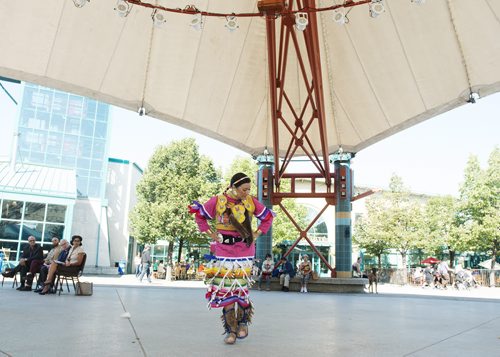 Shannon Bear from Peguis First Nations dances in her jingle dress at the Forks on Thursday as the Canadian Museum of Human Rights reveals their opening weekend's performances on September 20th and 21st. Sarah Taylor / Winnipeg Free Press August 28, 2014