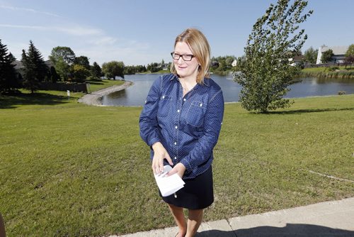 Mayoral Candidate Paul Havixbeck not concidering pulling out of the race ,  pledges to address infrastructure investment and upkeep over the longterm , she sites the the city of Wpg to be one of the first cities to use retention ponds  like this one in Whyte Ridge , and should look to be the first in other areas. Story by Aldo Santin  Aug 28 2014 / KEN GIGLIOTTI / WINNIPEG FREE PRESS