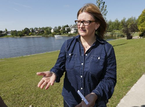 Mayoral Candidate Paul Havixbeck not concidering pulling out of the race , pledges to address infrastructure investment and upkeep over the longterm , she sites the the city of Wpg to be one of the first cities to use retention ponds  like this one in Whyte Ridge and should look to be the first in other areas. Story by Aldo Santin  Aug 28 2014 / KEN GIGLIOTTI / WINNIPEG FREE PRESS