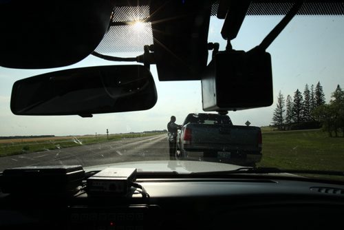 RCMP CPL Mark Hume  during traffic enforcement on Hyw #1 near Portage La Prairie  See Mary Agnes Welch  story- Aug 08, 2014   (JOE BRYKSA / WINNIPEG FREE PRESS)