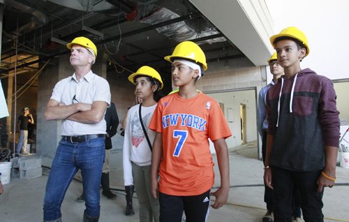 The tour of Amber Trails Community School, 1575 Templeton Ave., the new school is currently under construction. From left,  Education and Advanced Learning Minister James Allum and students that will be attending the school when it opens in January are  Ritu Oza, Inderpal Grewal and Pratik Suri get a tour of the school Thursday.       Nick Martin's start of school package. Wayne Glowacki/Winnipeg Free Press August 28 2014