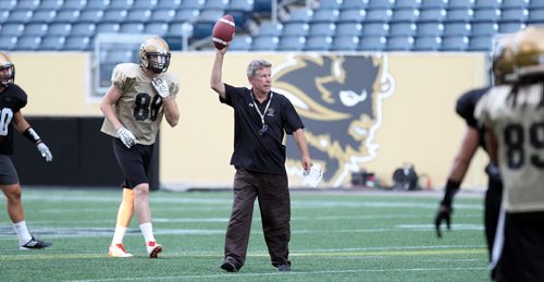 Brian Dobie coaching players for the front of Sports. Dobie commented today on this: A former University of Manitoba Bisons football player has tested positive for anabolic steroids, the U of M and Canadian Centre for Ethics in Sports confirmed this morning. Its just the second time ever a Bisons athlete has tested positive for performance enhancing drugs and the first time in over a decade. Ranji Atwall. The CCES said Ranji Atwall, a defensive line starter for the Bisons in 2012 and 2013 who has since graduated, tested positive while taking part in a CFL Regional Combine in Edmonton Mar. 17, 2014 -- one of three players who tested positive at that event. August 28, 2014 - (Phil Hossack / Winnipeg Free Press)