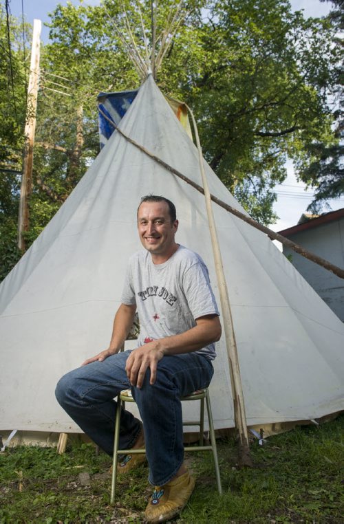 140828 Winnipeg - DAVID LIPNOWSKI / WINNIPEG FREE PRESS  Joe Lanceley also known as Tipi Joe rents and builds tipis. He is pictured with one of his Tipis in his backyard Thursday August 28, 2014.   49.8 INTERSECTION -