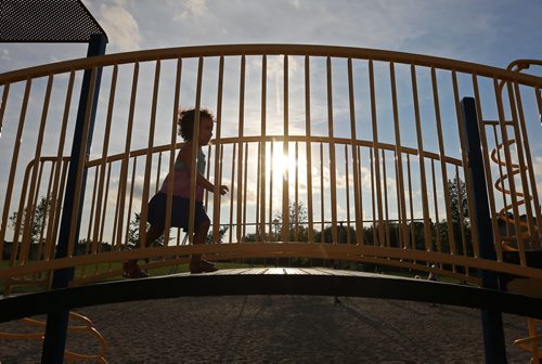 Aubree Delorme, 2, plays on a structure in a park on Shorehill Drive in St.Vital, Thursday, August 28, 2014. (TREVOR HAGAN/WINNIPEG FREE PRESS)