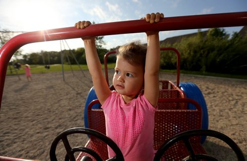 Avery Chan, 21 mo, plays on a structure in a park on Shorehill Drive in St.Vital, Thursday, August 28, 2014. (TREVOR HAGAN/WINNIPEG FREE PRESS)