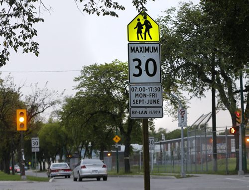 Stdup CAUTION School Zone  speed reduction  takes place starting Holiday Monday ,speeds around Wpg's171 elementary schools will be reduced to 30k/h  the fine is $310 for a going 50k/h or  20k/h over .  Aug 29 2014 / KEN GIGLIOTTI / WINNIPEG FREE PRESS