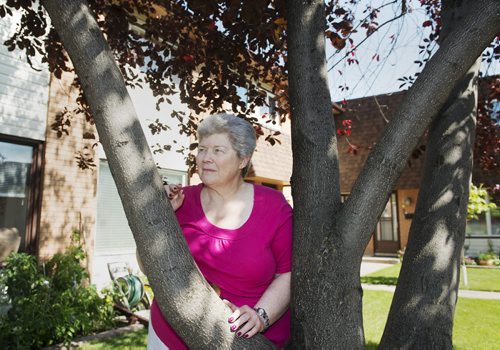 Linda Lee stands outside her home on Thursday afternoon. Lee volunteers on the board of the Manitoba chapter of the International Association of Business Communications and has been involved with the board since 1974. Sarah Taylor / Winnipeg Free Press August 28, 2014