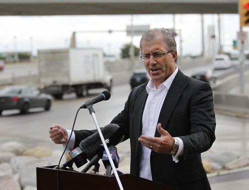 On Friday, Mayoral candidate Gord Steeves makes an announcement on panhandling at intersections. The media briefing was on Main St. at Stradbrook Ave. Aldo Santin story Wayne Glowacki/Winnipeg Free Press August 29 2014