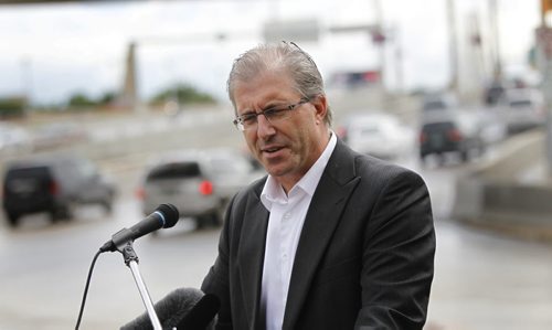 On Friday, Mayoral candidate Gord Steeves makes an announcement on panhandling at intersections. The media briefing was on Main St. at Stradbrook Ave.   Aldo Santin story Wayne Glowacki/Winnipeg Free Press August 29 2014
