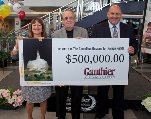 Gauthier Automotive group recently presented a $500,000 cheque to the Friends of the Canadian Museum for Human Rights at its McPhillips Street dealership. The CMHRs opening weekend is Sept. 20 and 21. Pictured (from left) are Gail Asper (CMHR board member), Jim Gauthier and Randy Gauthier. (John Johnston / Winnipeg Free Press)   (L-R) Gail Asper, Jim Gauthier, Randy Gauthier