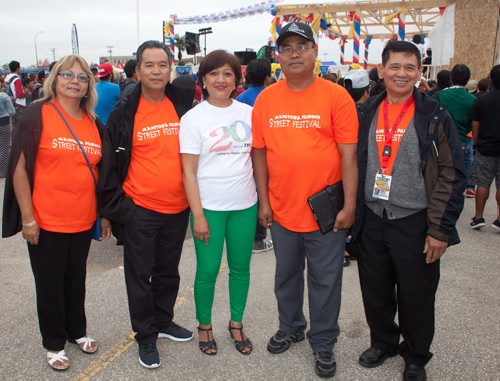 The third annual Manitoba Filipino Street Festival included a colourful parade that ended at Garden City Shopping Centre, where the festival offered entertainment on the mainstage. Pictured (from left) are organizers Vicky Tumolba, Rudy Capistrasno, Aida Champagne, Fred Sion and Prisco Madayag. (John Johnston / Winnipeg Free Press)